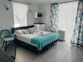 Отели типа «постель и завтрак» Solar Bed & Breakfast Карвия Четырехместный номер с балконом-1